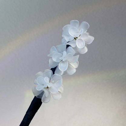 Pince à chignon fleurs clip rotatif coiffures faciles 2026