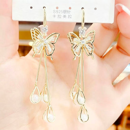 ✨ Boucles d’Oreilles Papillon Scintillantes en Cristal Œil-de-Chat à Pampilles