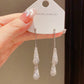 ✨ Élégantes boucles d’oreilles en forme de goutte – Le chic à la française, sublimé par des oxydes de zirconium étincelants ! 💎🤍