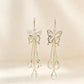 ✨ Boucles d’Oreilles Papillon Scintillantes en Cristal Œil-de-Chat à Pampilles